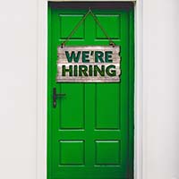 A Door With A Sign That Says &Quot;We'Re Hiring&Quot;